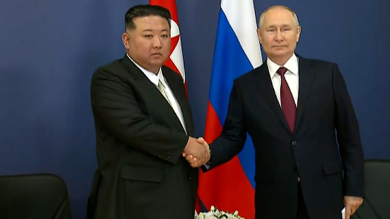 Kim Jong Un and Vladimir Putin shake hands as they begin their talks at the Vostochny Cosmodrome, Amur region, Russia, on September 13.