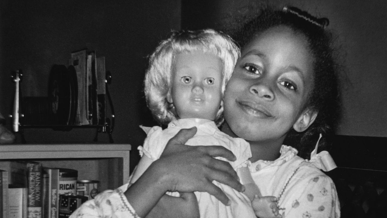 Denise McNair, one of the victims of the 16th Street Baptist Church bombing poses with her favorite Chatty Cathy doll in September 1963 in Birmingham, Alabama.  (Photo by Chris McNair/Getty Images)