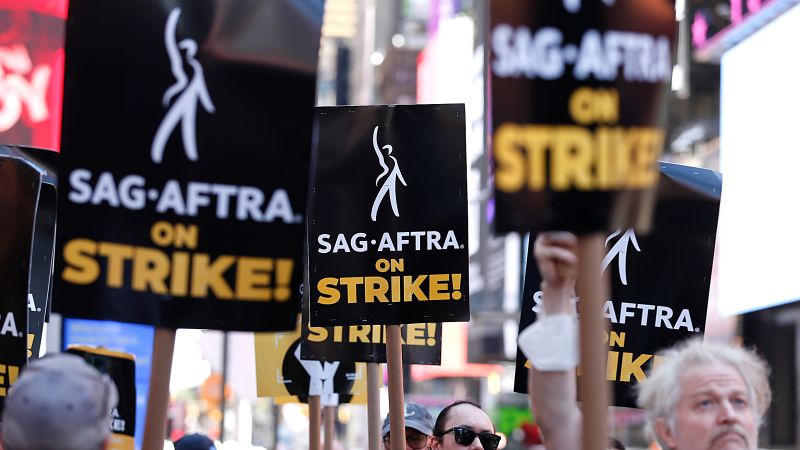 NextImg:Hire Adam Scott to walk your dog or Natasha Lyonne for crossword help to benefit crews affected by Hollywood strikes | CNN
