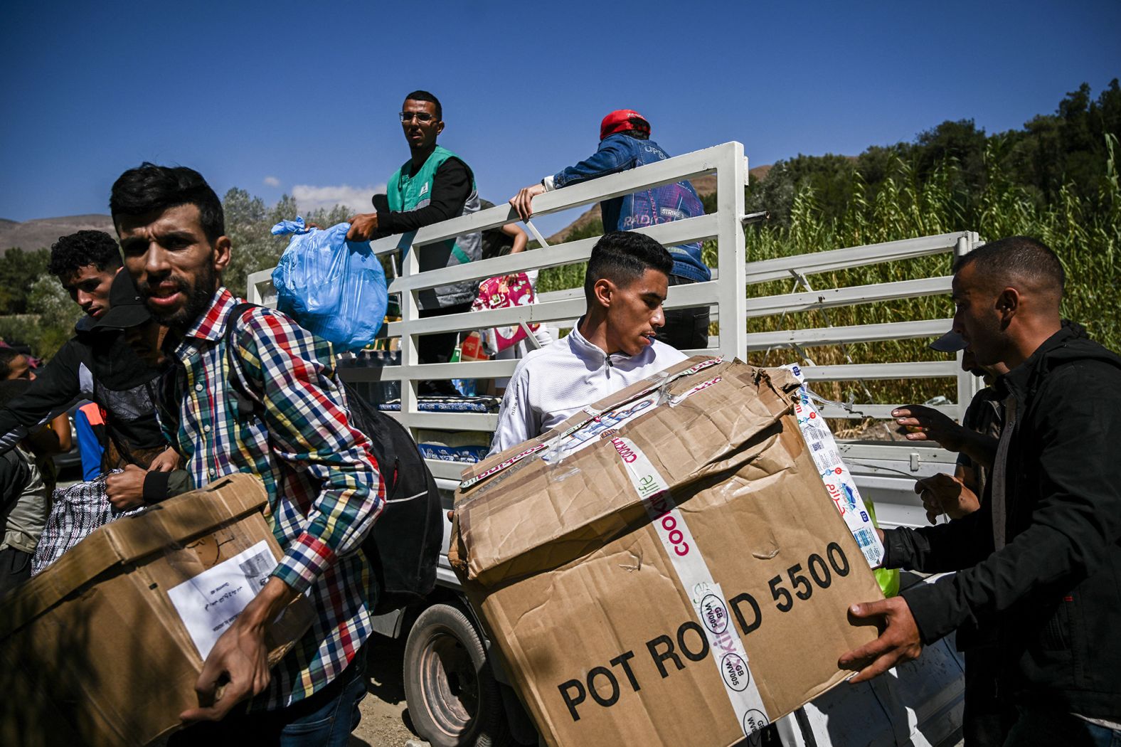 Volunteers distribute relief goods to earthquake victims near Adassil, Morocco, on September 13.
