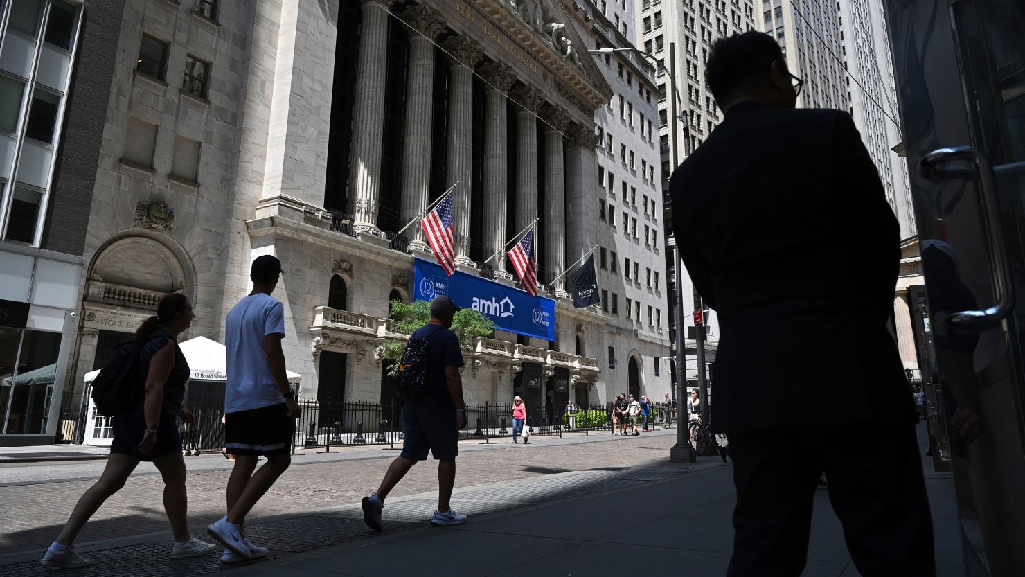 Photo by: NDZ/STAR MAX/IPx 2023 8/1/23 People walk past the New York Stock Exchange (NYSE) on Wall Street on August 1, 2023 in New York City.