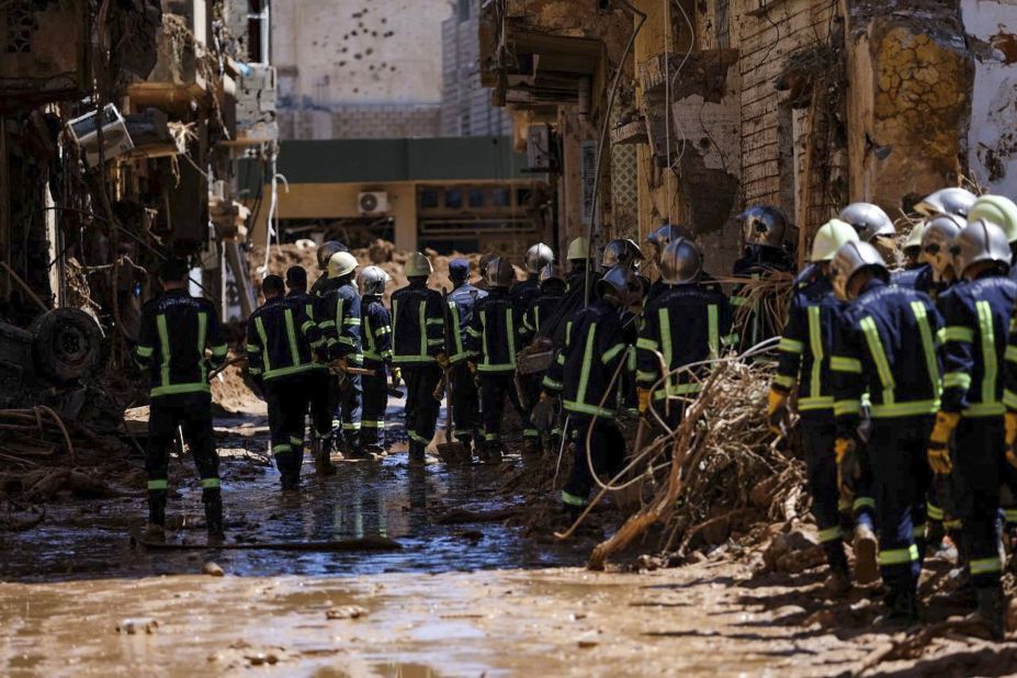 Rescuers inspect damaged areas in Derna on September 13.