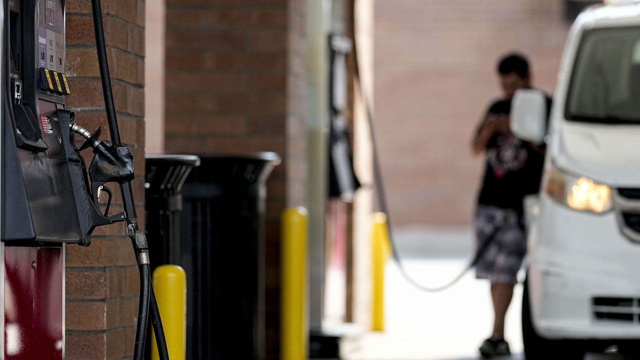 A person pumps gas, Tuesday, Sept. 12, 2023, in Marietta, Ga. 
