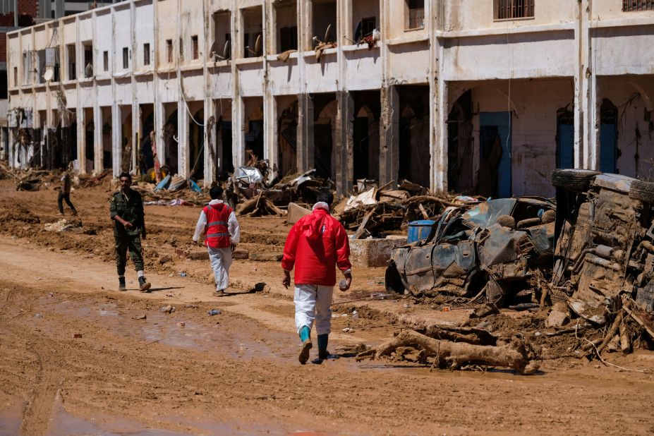 Members of the Libyan Red Crescent walk in Derna on September 13.
