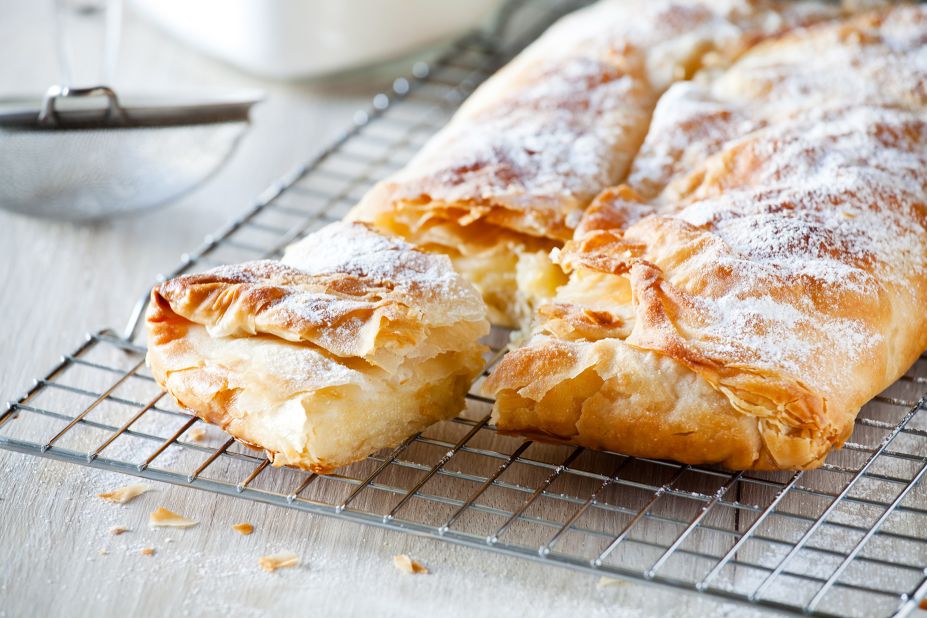 <strong>Bougatsa (Μπουγάτσα): </strong>Hailing from Thessaloniki, this traditional Greek dessert consists of filo pastry wrapped around a sweet semolina-based custard. 