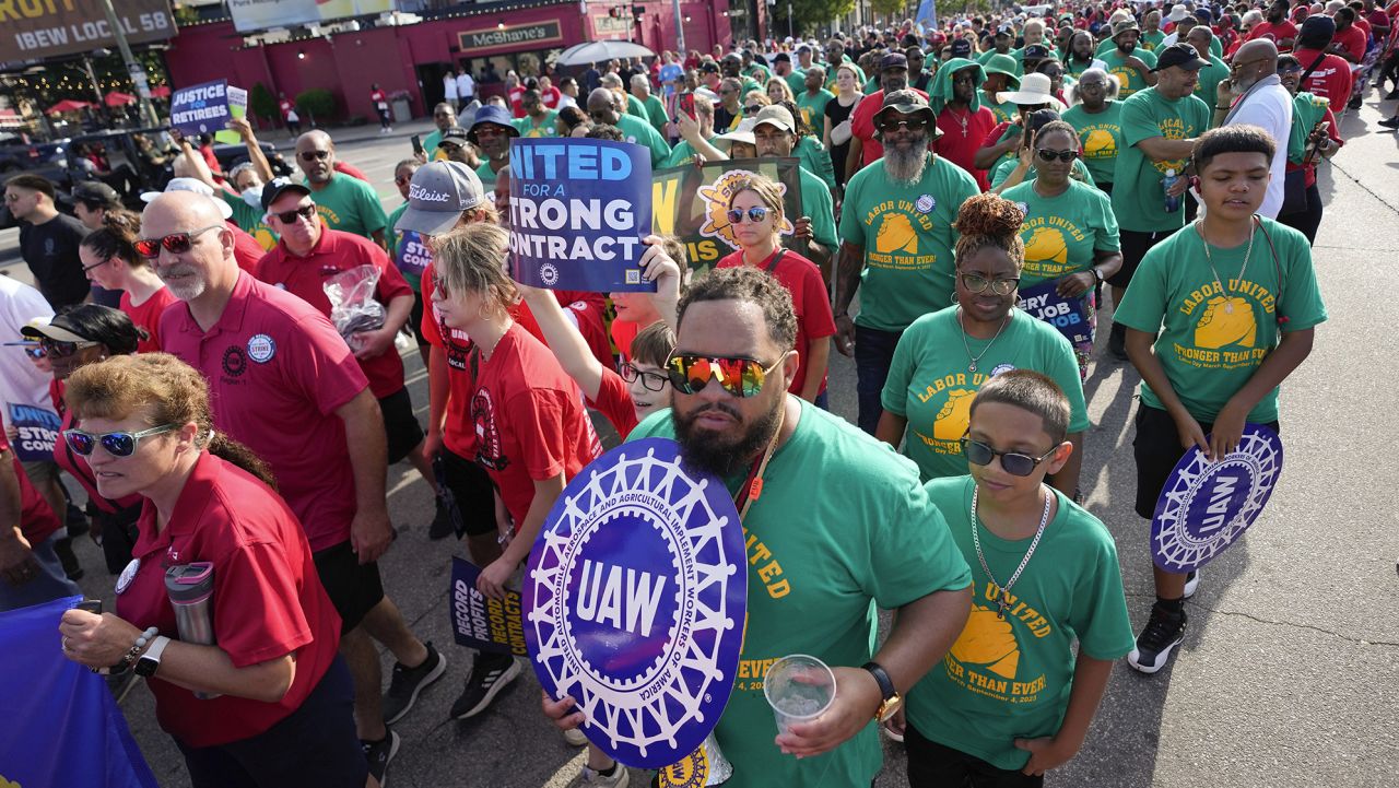 File - United Auto Workers members walk in the Labor Day parade in Detroit on Sept. 4, 2023. The union is threatening to strike any automaker that hasn't reached an agreement by the time contracts expire on Sept. 14. (AP Photo/Paul Sancya, File)