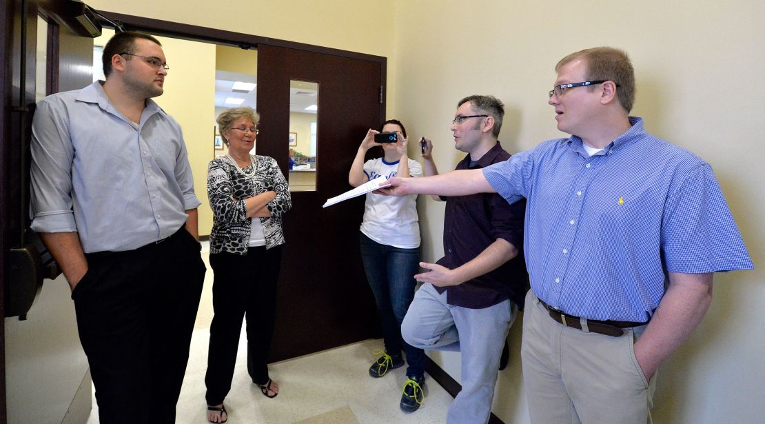 In 2015, David Ermold, right, attempts to hand Rowan County clerks a copy of the ruling from U.S. District Court Judge David Bunning instructing the county to start issuing marriage licenses.