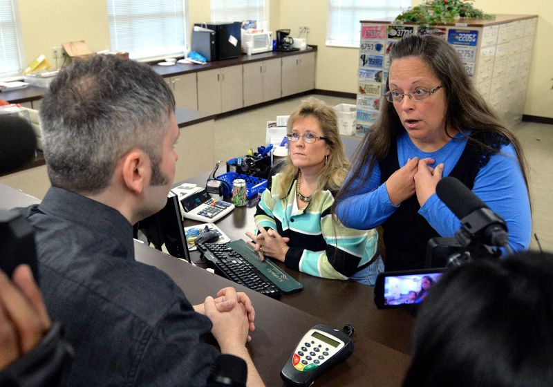 Same-sex couple denied marriage licenses from county clerk awarded $100,000 in damages picture picture