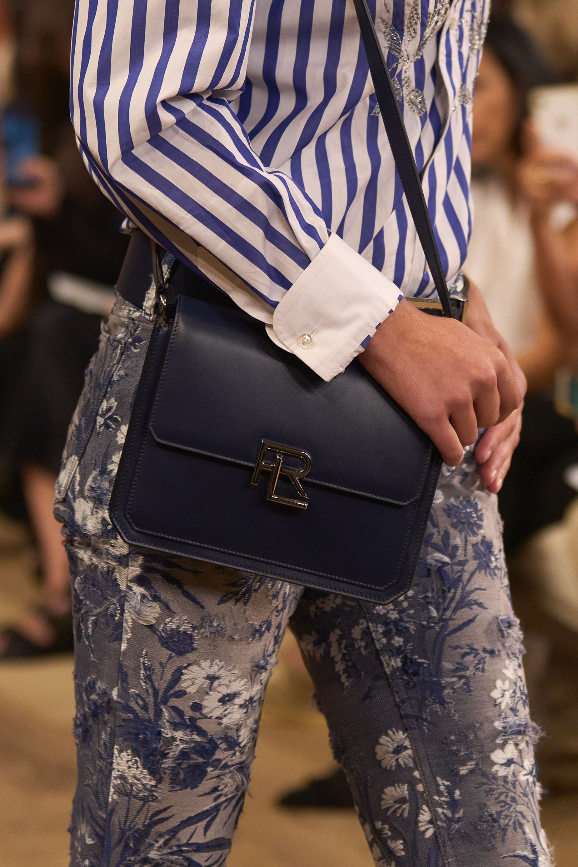 A detail shot from the collection highlights its floral detailing on denim pieces, and the brand's new RL 888 handbag.