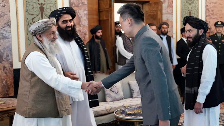 In this handout photo released by Taliban Prime Minister Media Office, China's new ambassador to Afghanistan Zhao Sheng shakes hand with Taliban Prime Minister Mohammad Hasan Akhund, left, during the recognition ceremony at the Presidential Palace, in Kabul, Afghanistan, Wednesday, September 13, 2023. 