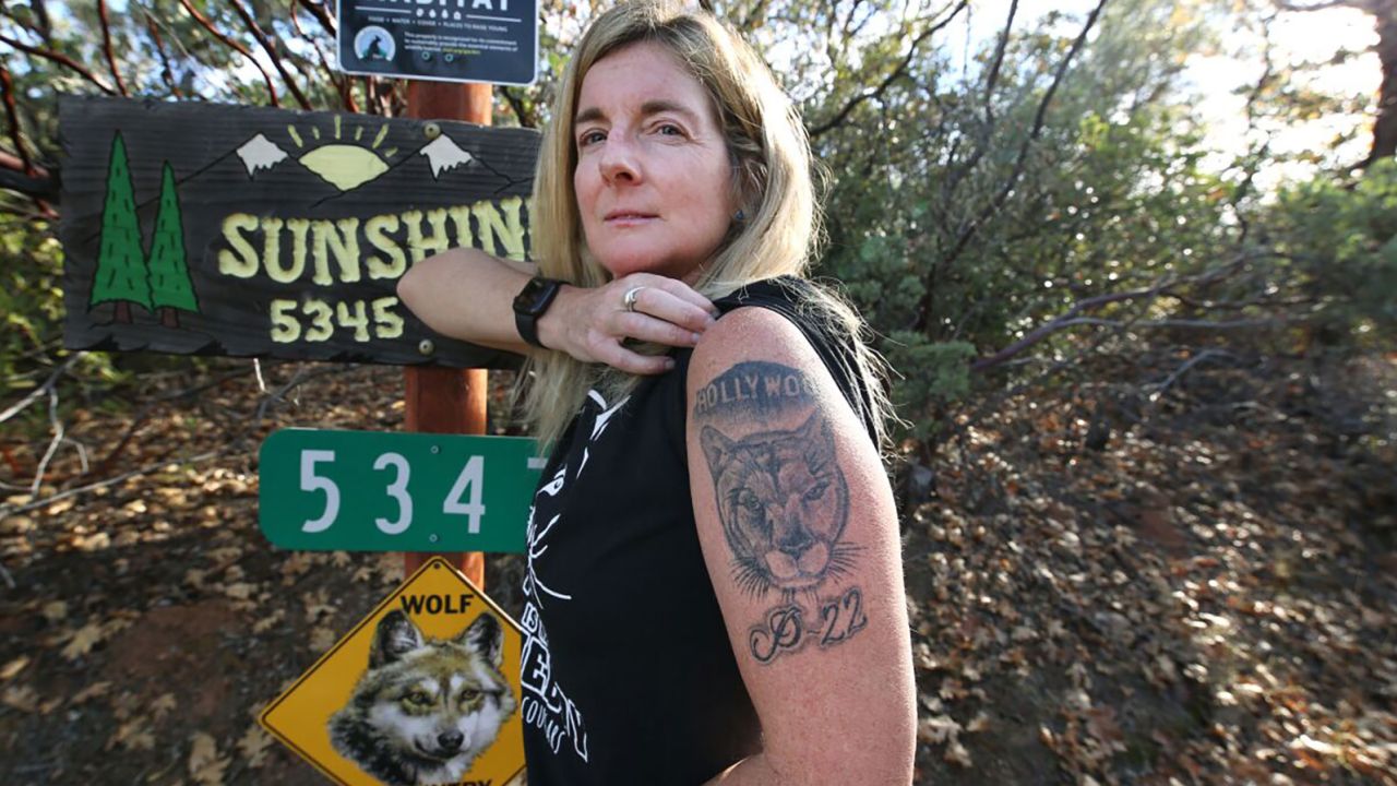 Beth Pratt shows off her P-22 tattoo.