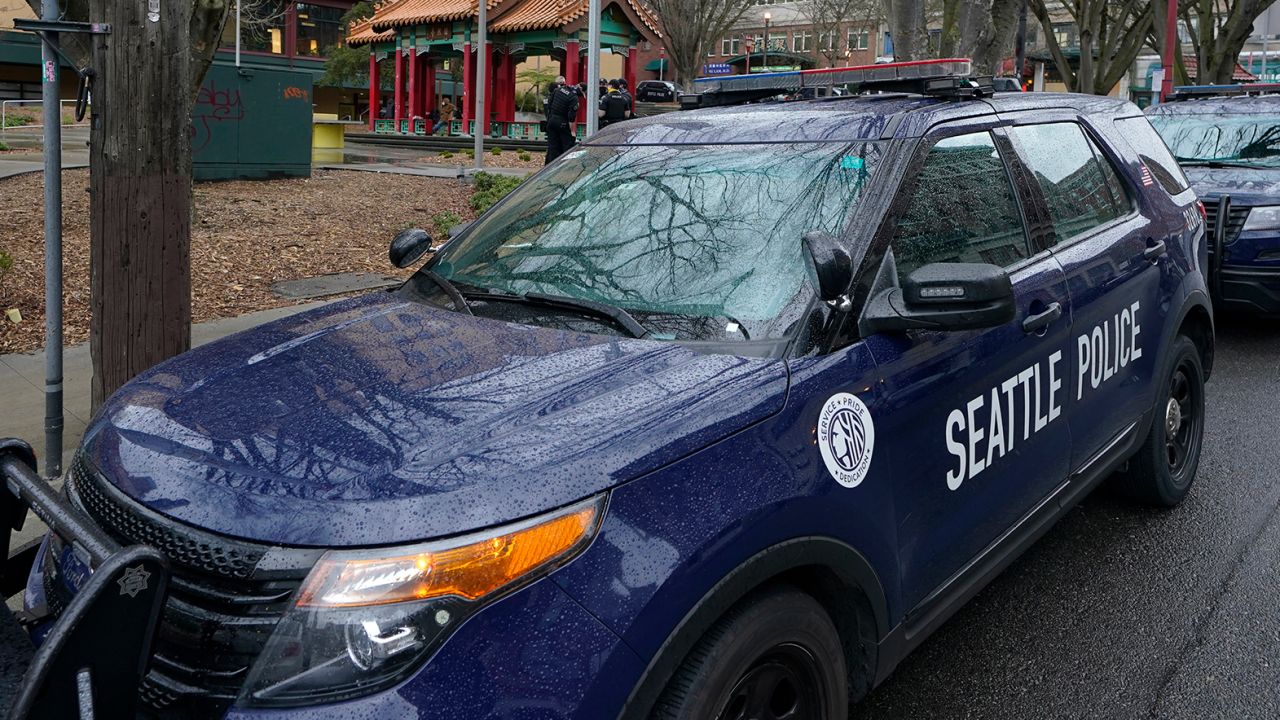 A Seattle Police Department vehicle sits parked at Hing Hay Park in the heart of Seattle's Chinatown-International District, on March 18, 2021.