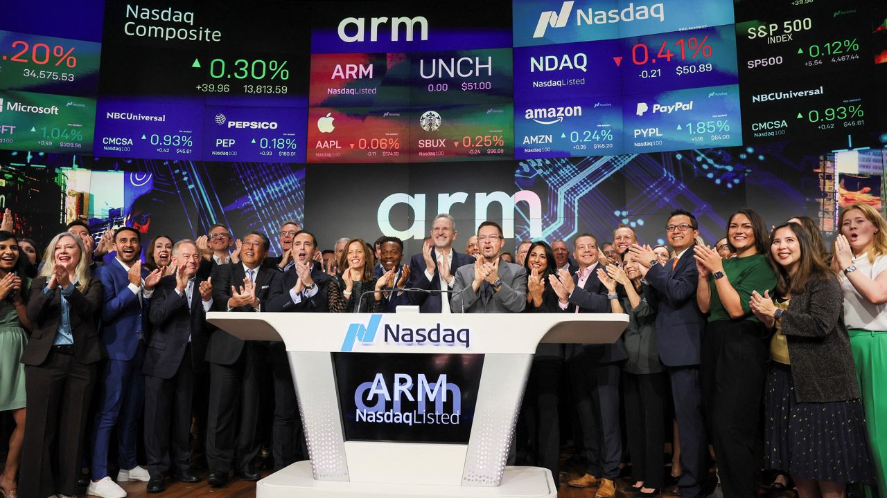 Arm CEO Rene Haas and executives cheer as Softbank's Arm, a chip design firm, holds an initial public offering on September 14, 2023.