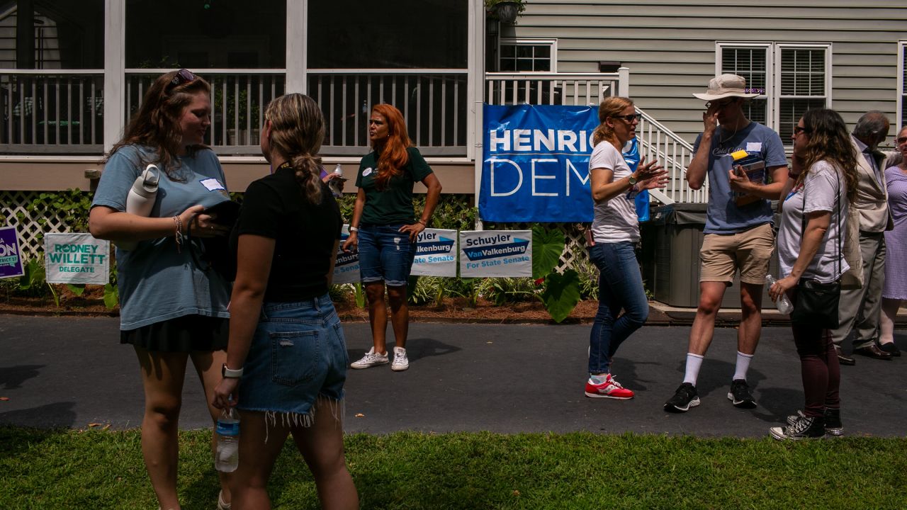 People chat after a rally and canvassing event with Sen. Tim Kaine in Glen Allen, Virginia, on Saturday, September 9.