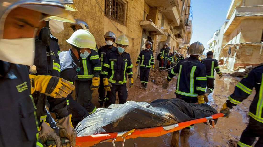 A body is carried away in Derna on September 13.