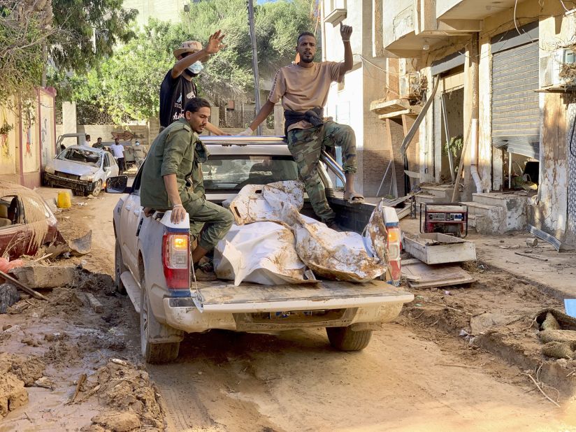 Bodies of flooding victims are transported in Derna on Wednesday, September 13.