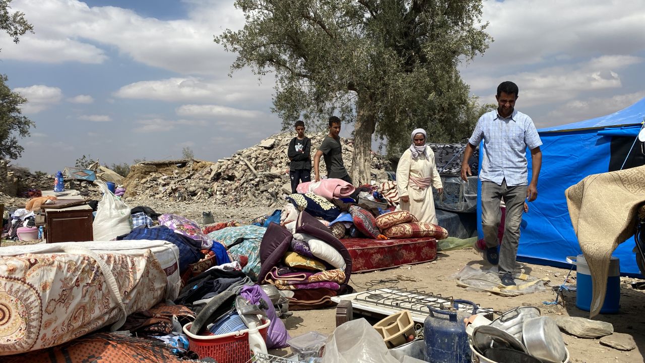 Abdu Brahim and his wife Hanan Ait Brahim sort through the items they recovered from the rubble of their home, where their 7-year-old daughter died.
