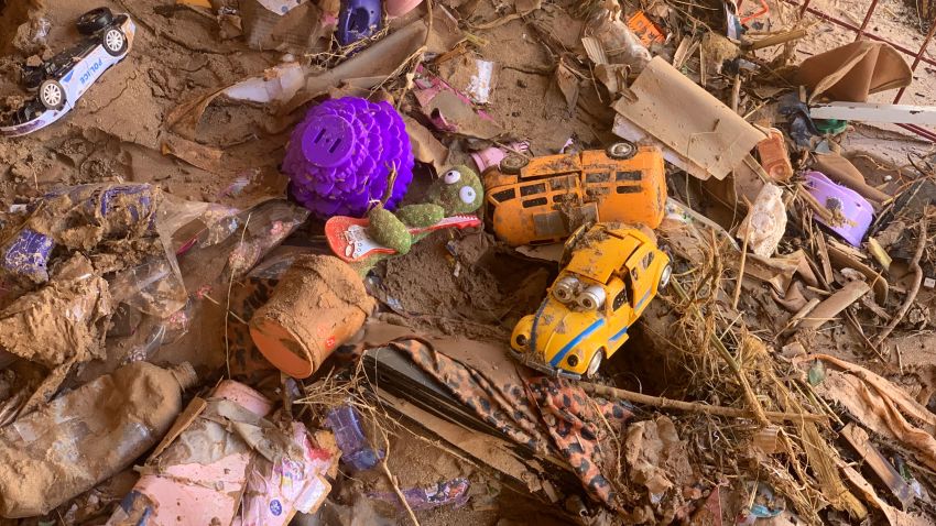 Toys are scattered outside a damaged house in Derna, Libya, Thursday, Sept.14, 2023. Search teams are combing streets, wrecked buildings, and even the sea to look for bodies in Derna, where the collapse of two dams unleashed a massive flash flood that killed thousands of people. (AP Photo/Yousef Murad)