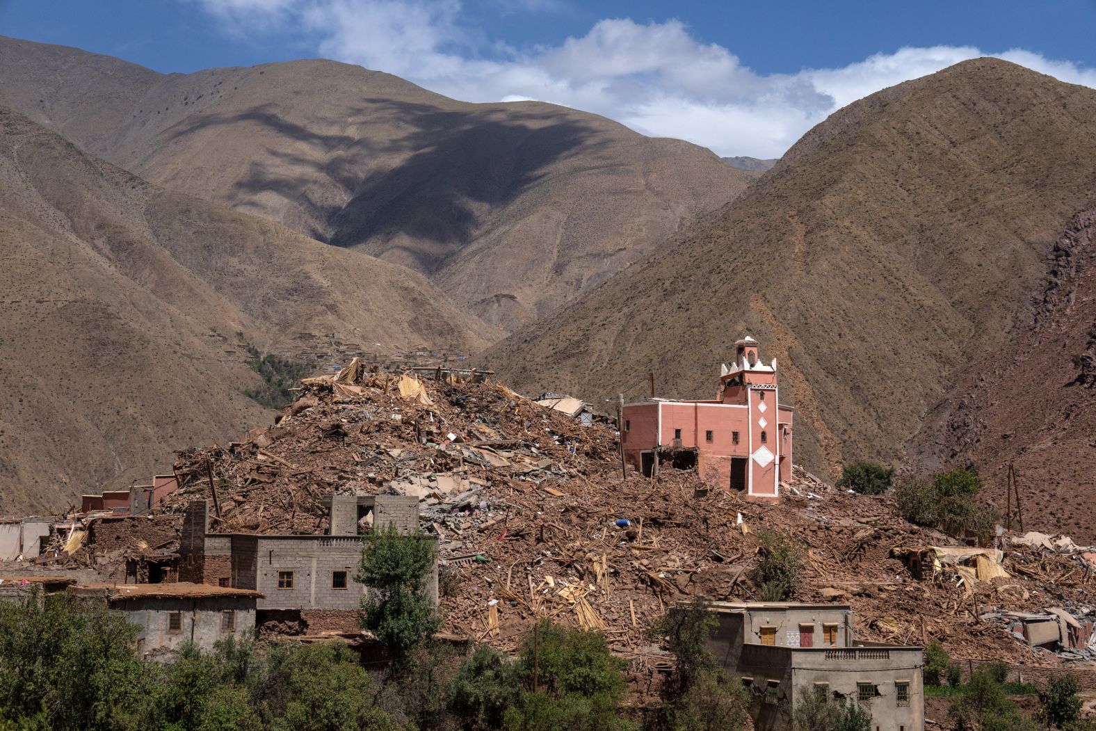 Collapsed buildings surround a mosque in Ighil, Morocco, on Thursday, September 14.