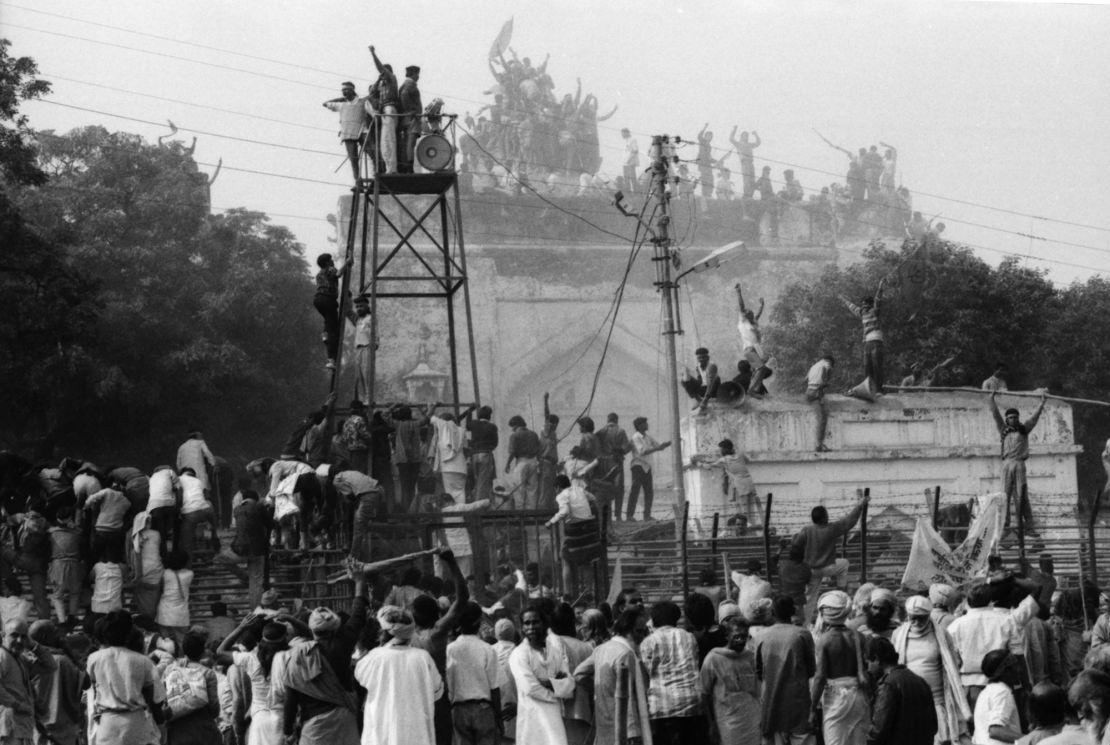 Hindu fundamentalists  climb the dome of Babri Masjid in Ayodhya to demolish the structure on December 6, 1992. 