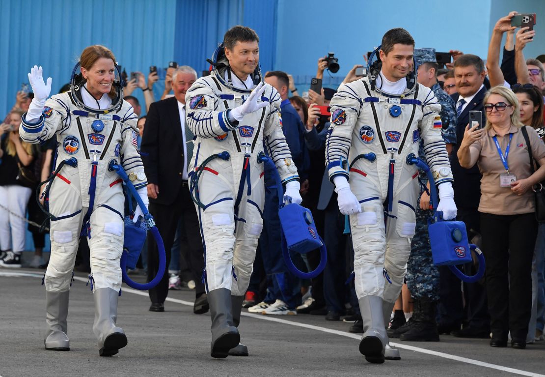 (From L) US NASA astronaut Loral O'Hara and Russian Roscosmos cosmonauts Oleg Kononenko and Nikolai Chub, members of the International Space Station (ISS) Expedition 70-71 main crew, walk to report to the head of the Russian space agency Roscosmos during the pre-launch preparations in the Russian leased Baikonur cosmodrome in Kazakhstan on September 15, 2023. The trio of US NASA astronaut Loral O'Hara, Russian Roscosmos cosmonauts Oleg Kononenko and Nikolai Chub is scheduled to launch aboard their Soyuz MS-24 spacecraft later on September 15. (Photo by VYACHESLAV OSELEDKO / POOL / AFP) (Photo by VYACHESLAV OSELEDKO/POOL/AFP via Getty Images)
