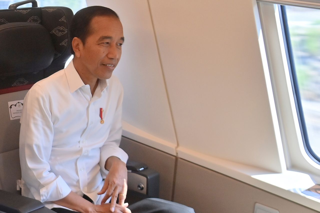 Indonesia's outgoing President Joko Widodo rides the high-speed railway during a test ride in Jakarta.