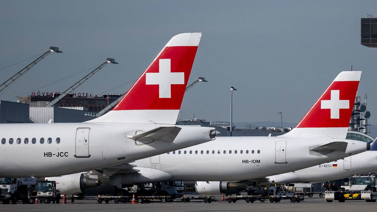In this May 2023 photo, commercial planes of Swiss air lines are parked on the tarmac of the Geneva Airport.