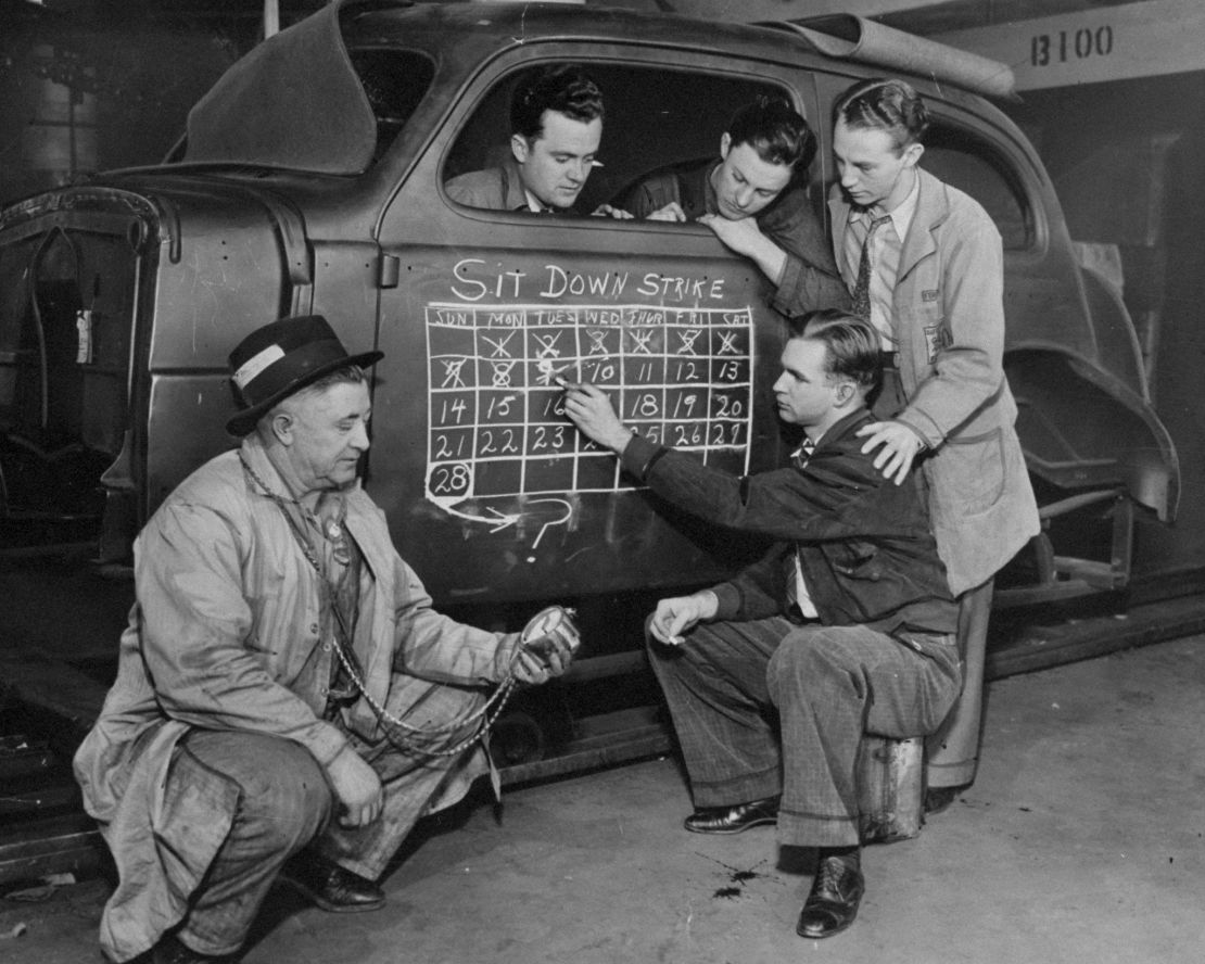 Strikers cross off number of days they have been on the sit-down strike at General Motors' Chevrolet auto plant in Flint on February 10, 1937.
