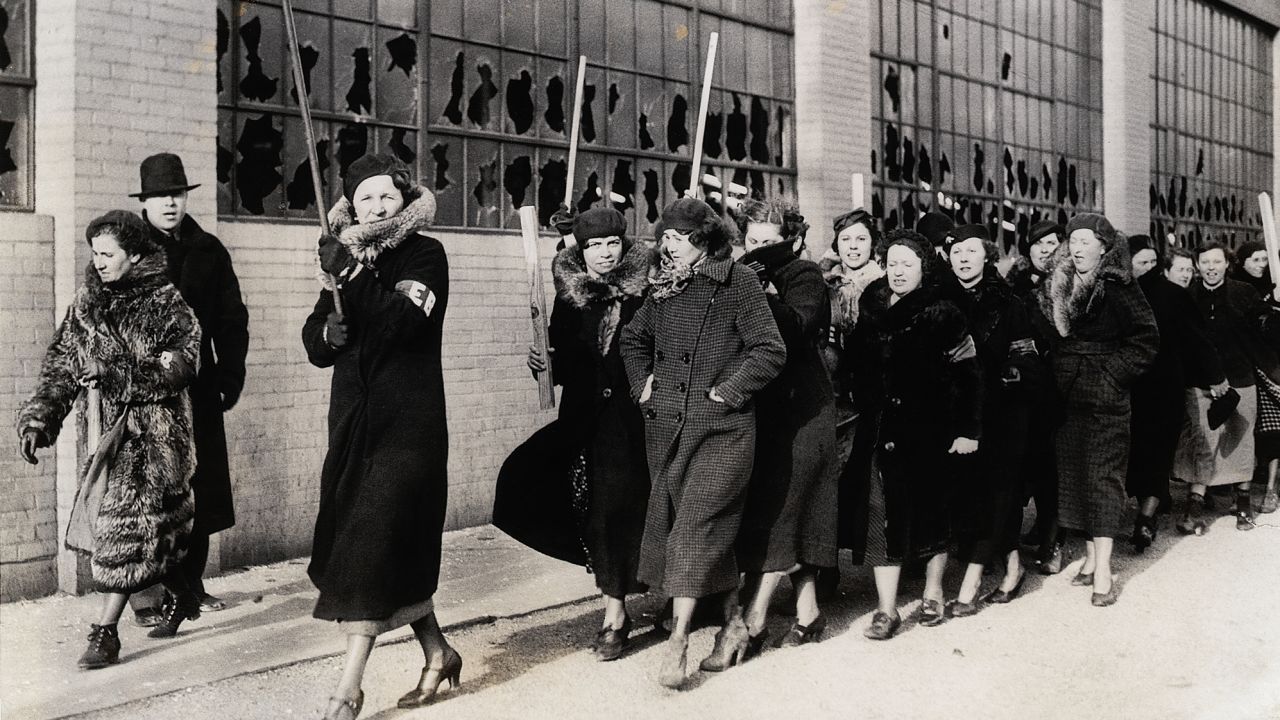 A march of strikers' wives  following the riot between strikers and policemen on February 1, 1937, in Flint.