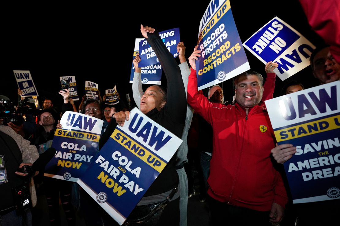 Striking United Auto Workers picket at Ford's Michigan Assembly Plant in Wayne, Mich., shortly after midnight Friday, Sept. 15, 2023. 