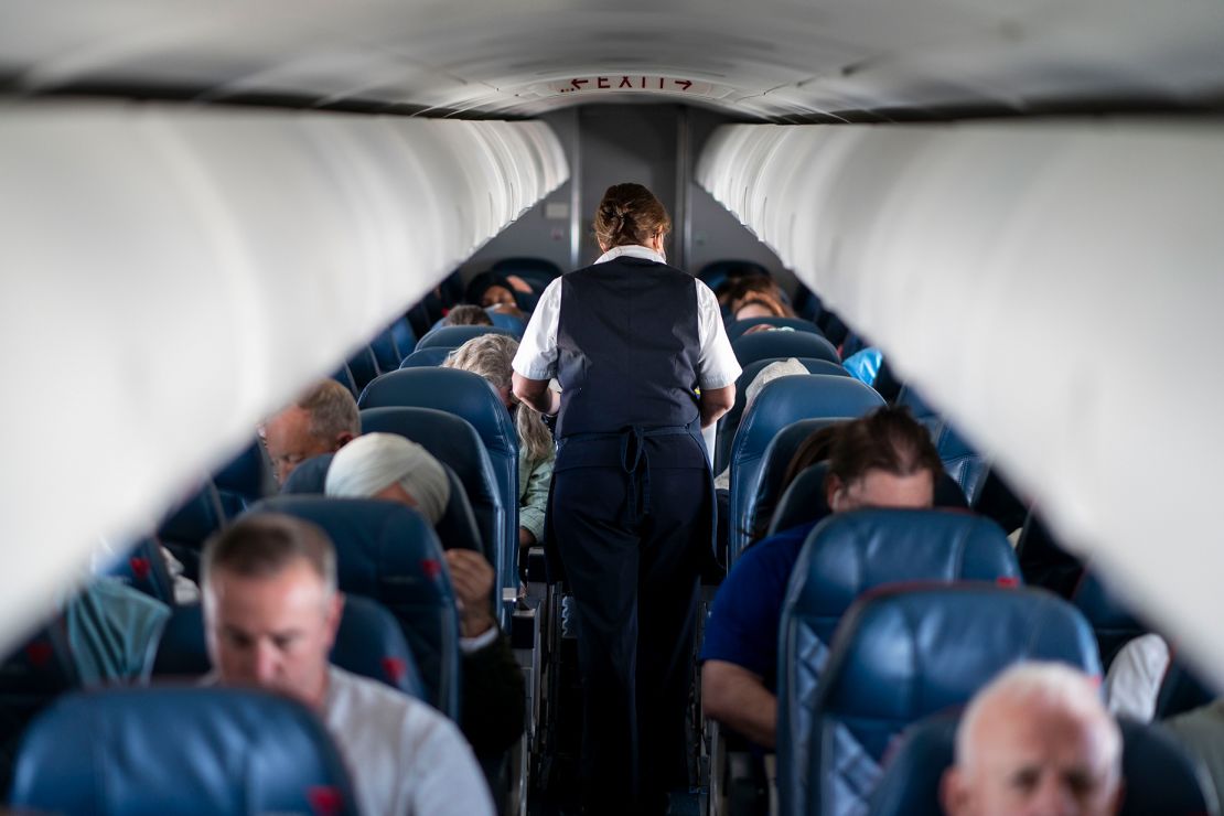 QUEENS, NY - MAY 04:  Passengers and flight attendants aboard a flight from LaGuardia Airport bound for Kansas City International Airport on Wednesday, May 4, 2022 in Queens, NY. (Kent Nishimura / Los Angeles Times via Getty Images)