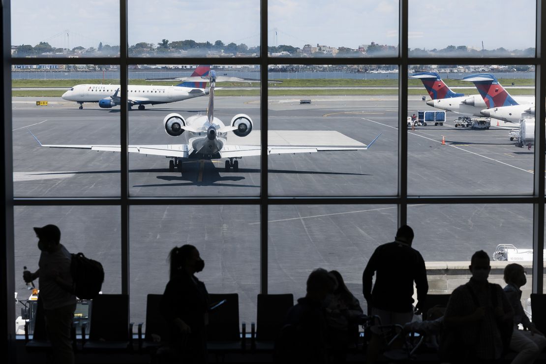 Delta Air Lines planes on the tarmac at Terminal C of LaGuardia Airport (LGA) in New York, U.S., on Monday, Aug. 2, 2021. Citing a surge in unruly passengers, U.S. aviation regulators are calling on the nation's airports to encourage the police to arrest offenders, and to prevent people from sneaking alcohol on board. Photographer: Angus Mordant/Bloomberg via Getty Images