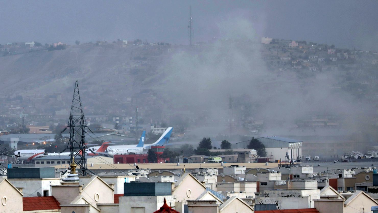 In this August 26, 2021 photo, smoke rises from a deadly explosion outside the airport in Kabul, Afghanistan.