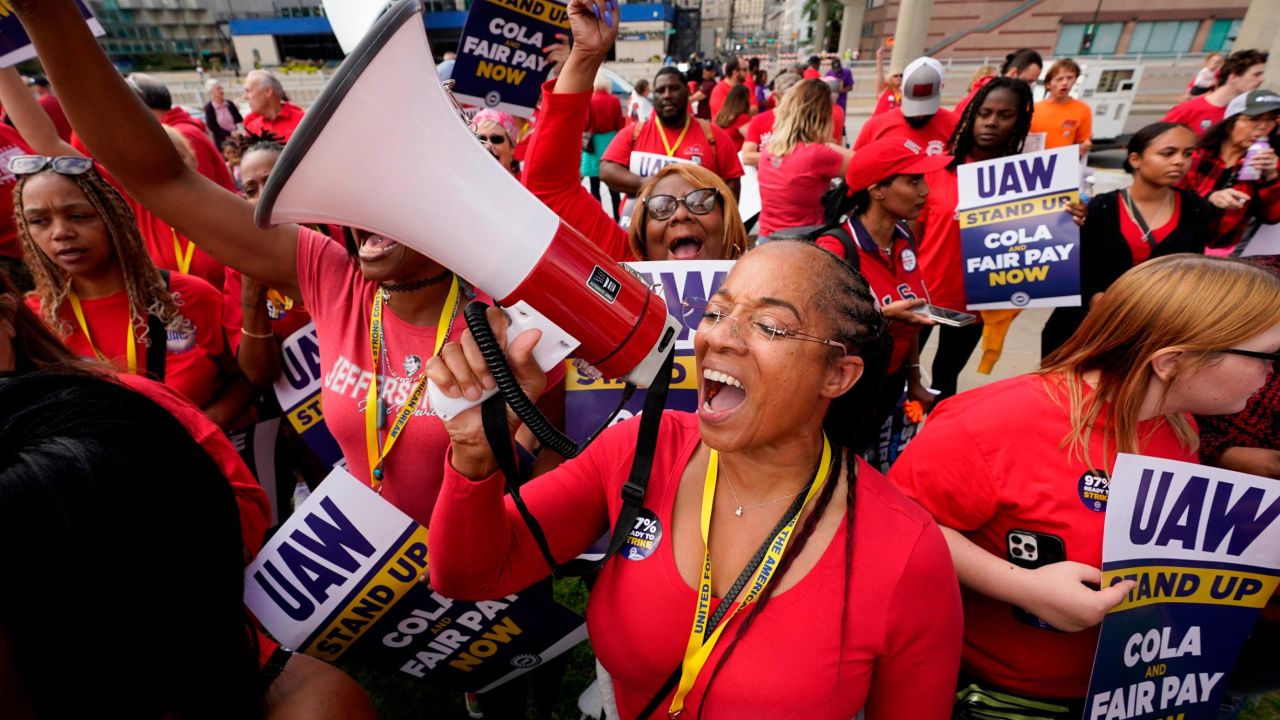 United Auto Workers member Tasha Johnson leads a chant while attending a rally in Detroit, Friday, Sept. 15, 2023. The UAW is conducting a strike against Ford, Stellantis and General Motors. (AP Photo/Paul Sancya)