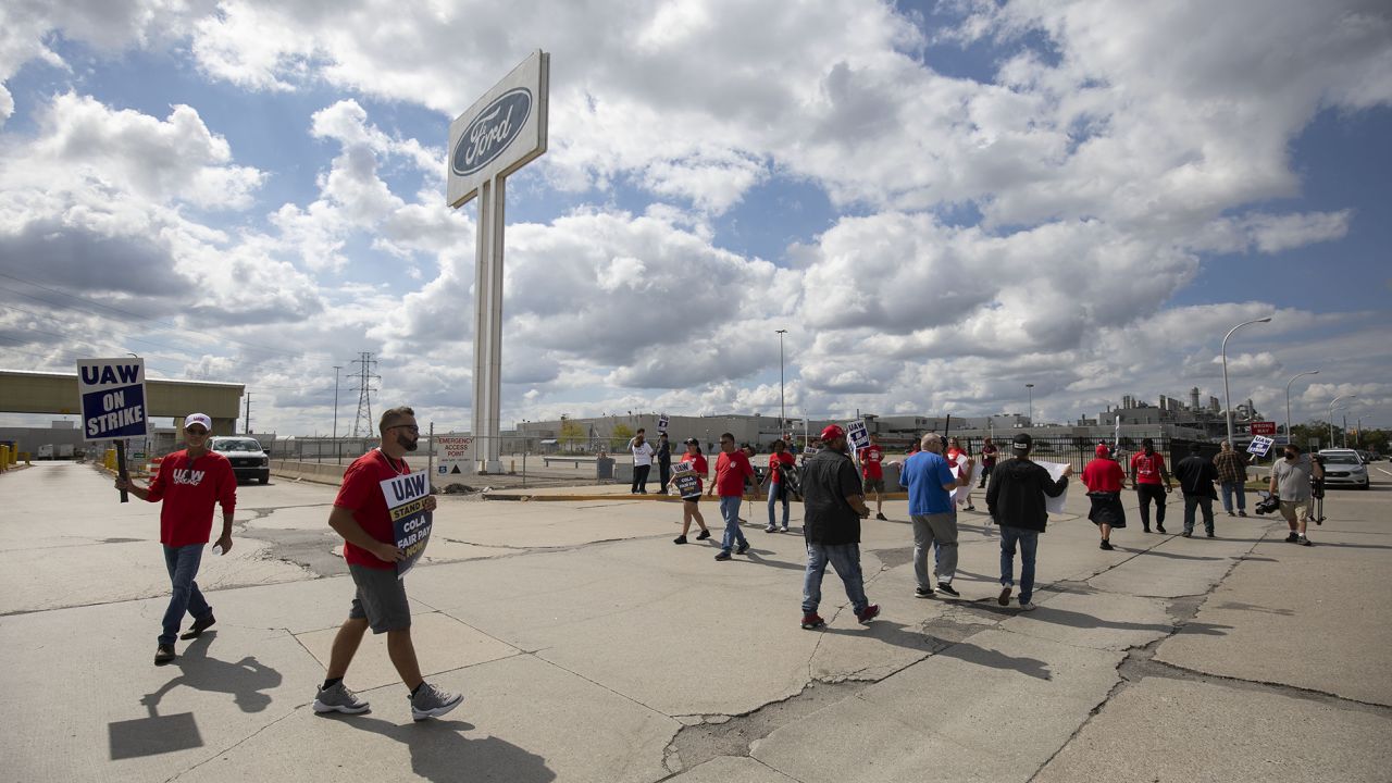 United Auto Workers members strike at the Ford Michigan Assembly Plant on September 15, 2023 in Wayne, Michigan. This is the first time in history that the UAW is striking all three of the Big Three auto makers, Ford, General Motors, and Stellantis, at the same time. 