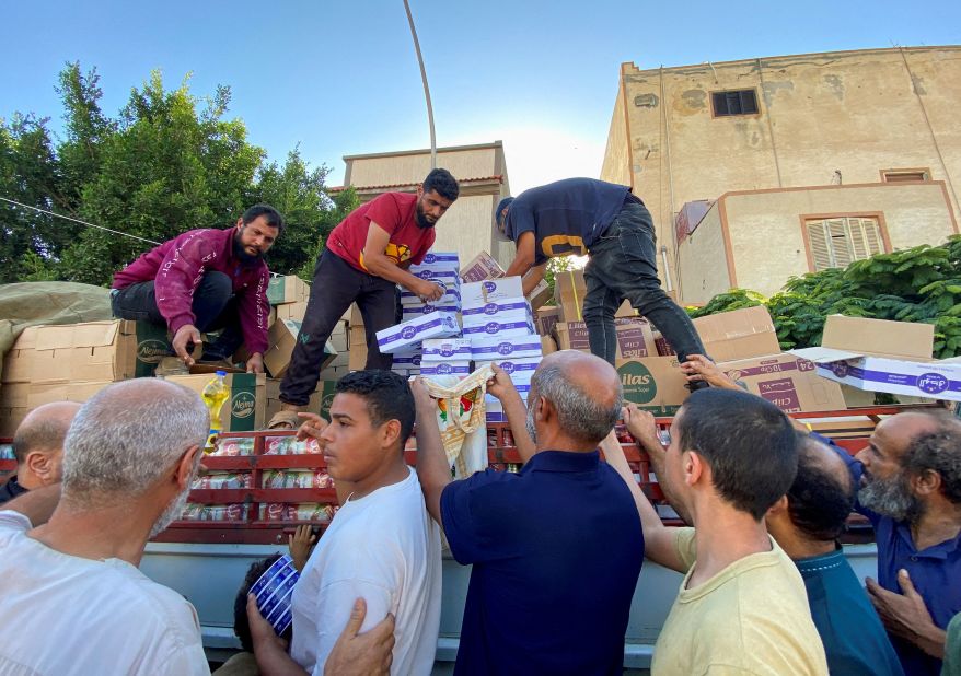 People line up to receive food aid in Derna on September 15.
