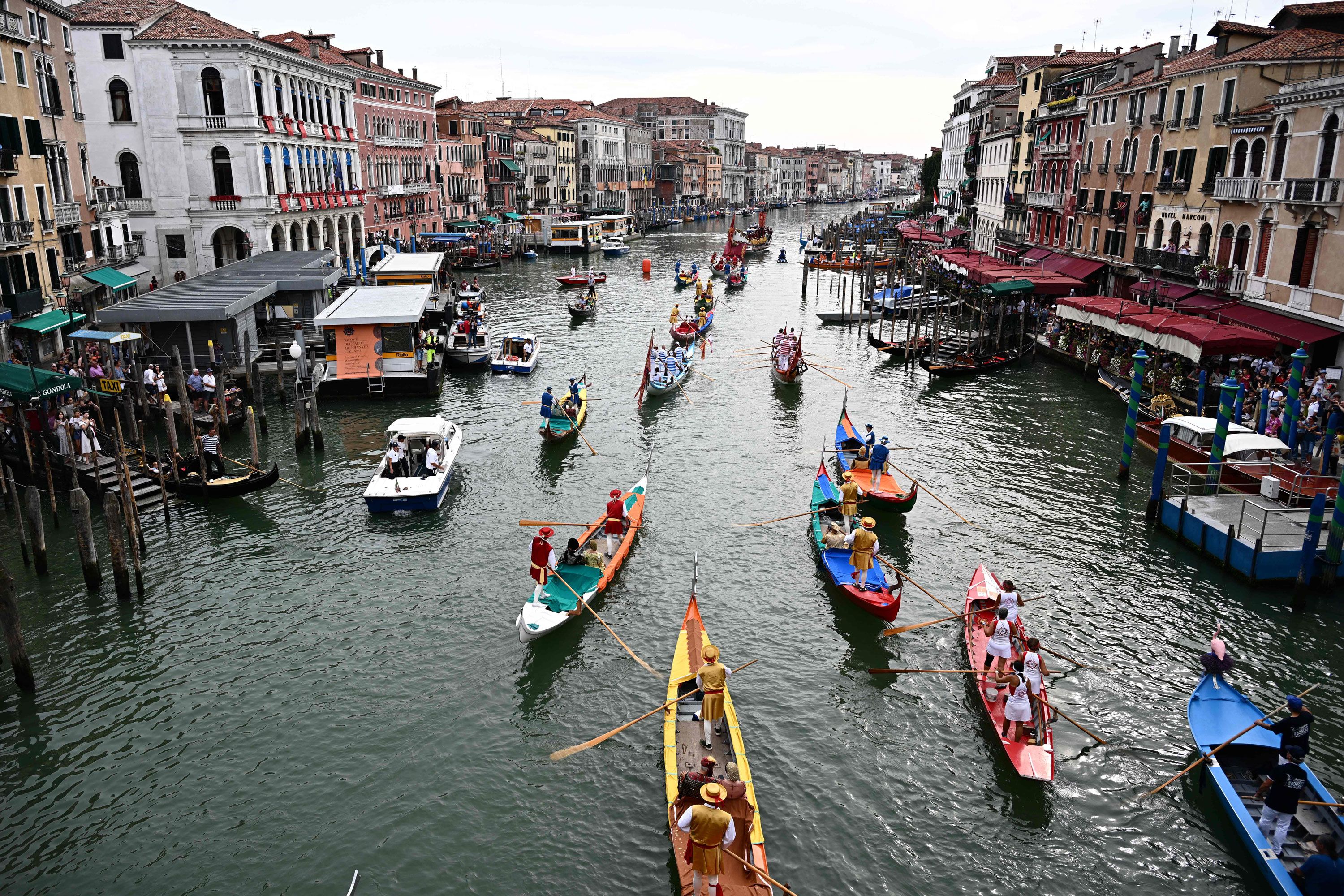 TOPSHOT - Rowers take part in the annual gondolas and boats Historical Regatta (Regata Storica) on the Grand Canal in Venice on September 3, 2023. (Photo by GABRIEL BOUYS / AFP) (Photo by GABRIEL BOUYS/AFP via Getty Images)
