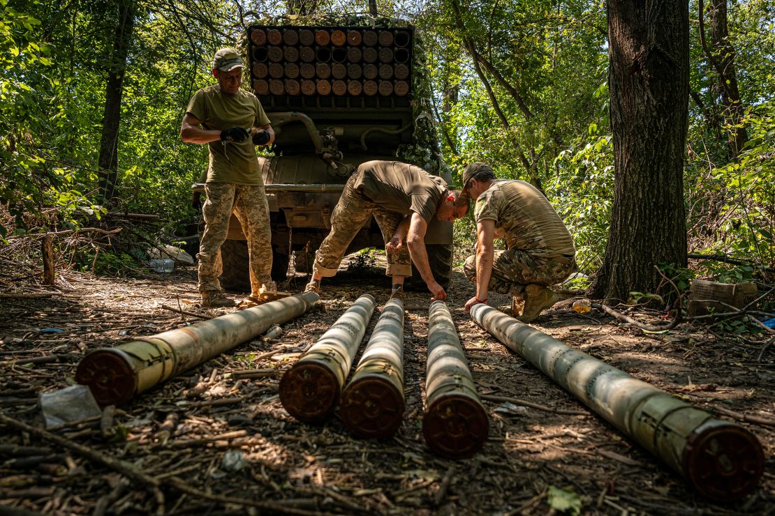 Ukrainian soldiers attach detonators to grad shells on August 9, 2023.