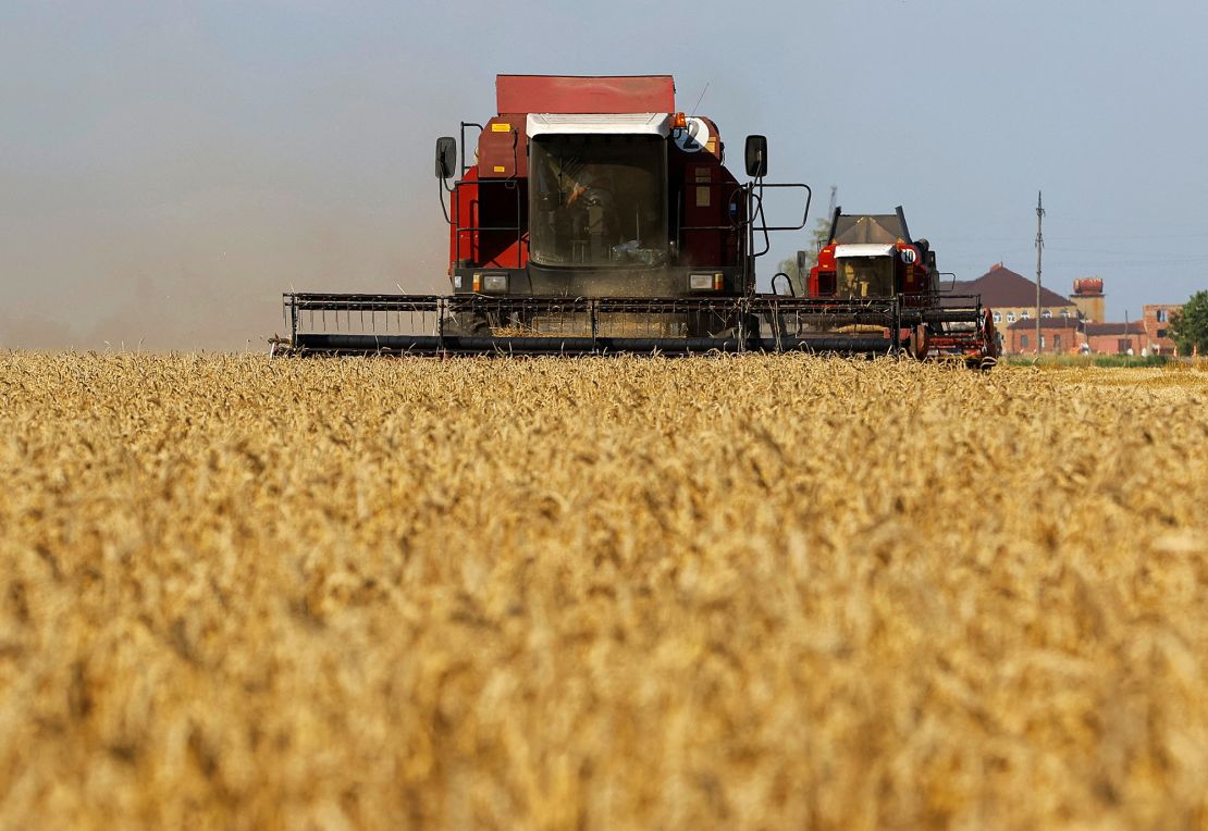 Combines harvest wheat in a field in the Zaporizhzhia region of Russian-controlled Ukraine.