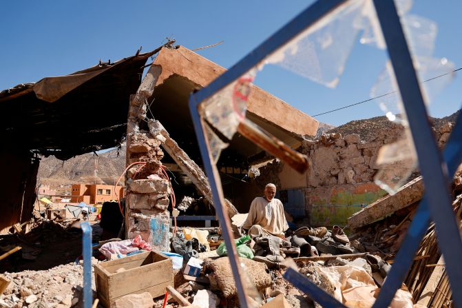 Ait Abdellah Brahim, 86, sits in rubble in Talat N'Yaaqoub, Morocco, on Saturday, September 16.