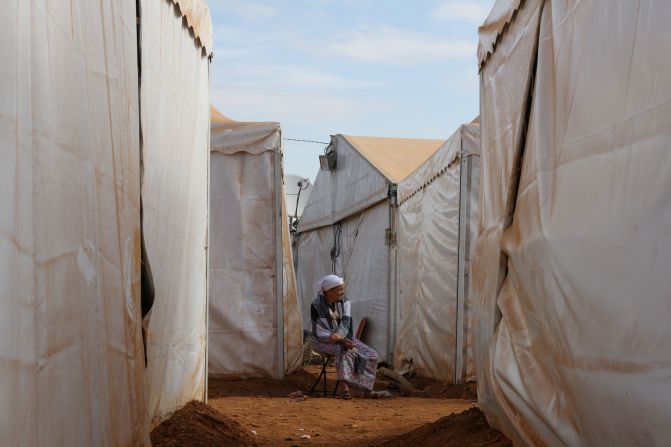 An elderly woman is surrounded by tents at the Regraga camp in Amizmiz, Morocco, on September 17.