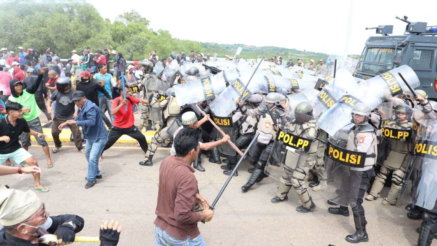Protesters opposed to resettlement plans clashed with riot police on September 11 outside government offices in Batam
