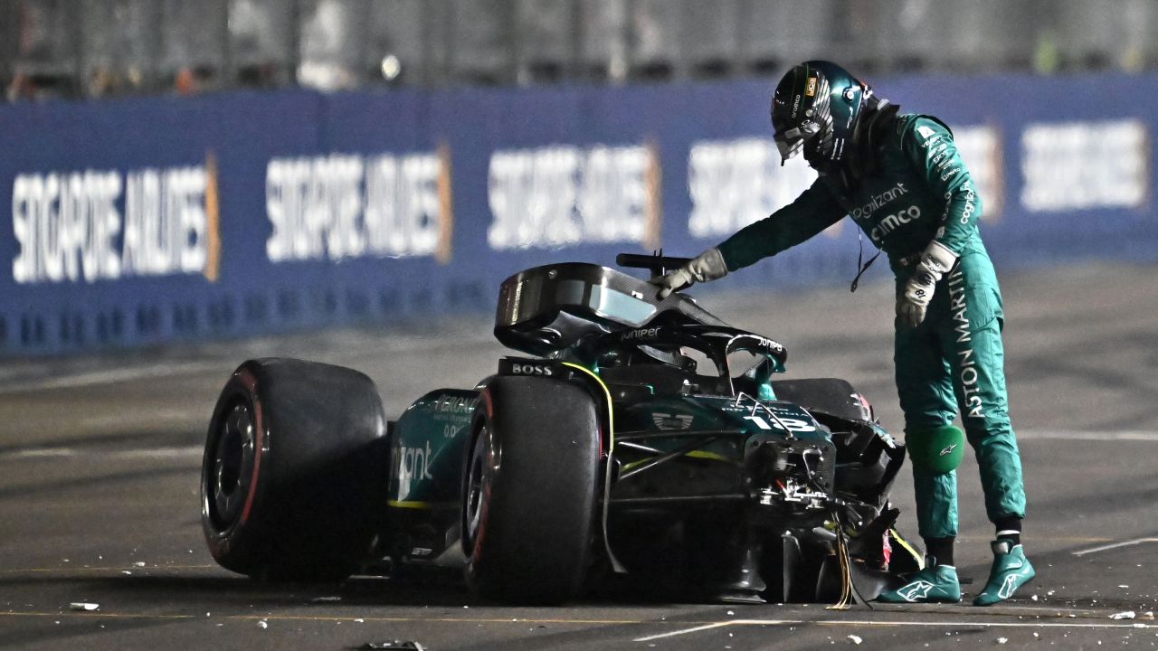 Aston Martin's Canadian driver Lance Stroll gets out of his car after crashing during the qualifying session of the Singapore Formula One Grand Prix night race at the Marina Bay Street Circuit in Singapore on September 16, 2023.