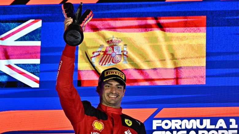 Ferrari's Spanish driver Carlos Sainz Jr celebrates on the podium after winning the Singapore Formula One Grand Prix night race at the Marina Bay Street Circuit in Singapore on September 17, 2023.