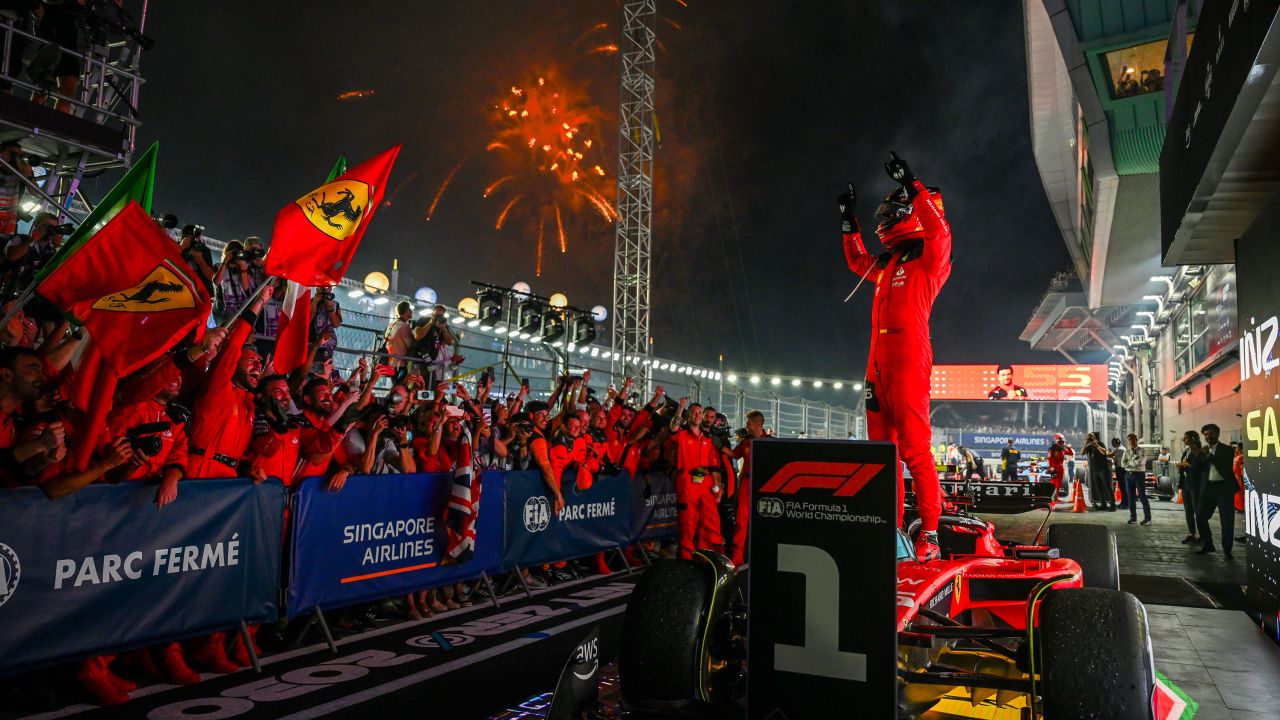 Race winner Carlos Sainz of Spain and Ferrari celebrates in parc ferme during the F1 Grand Prix of Singapore at Marina Bay Street Circuit on September 17, 2023 in Singapore, Singapore.