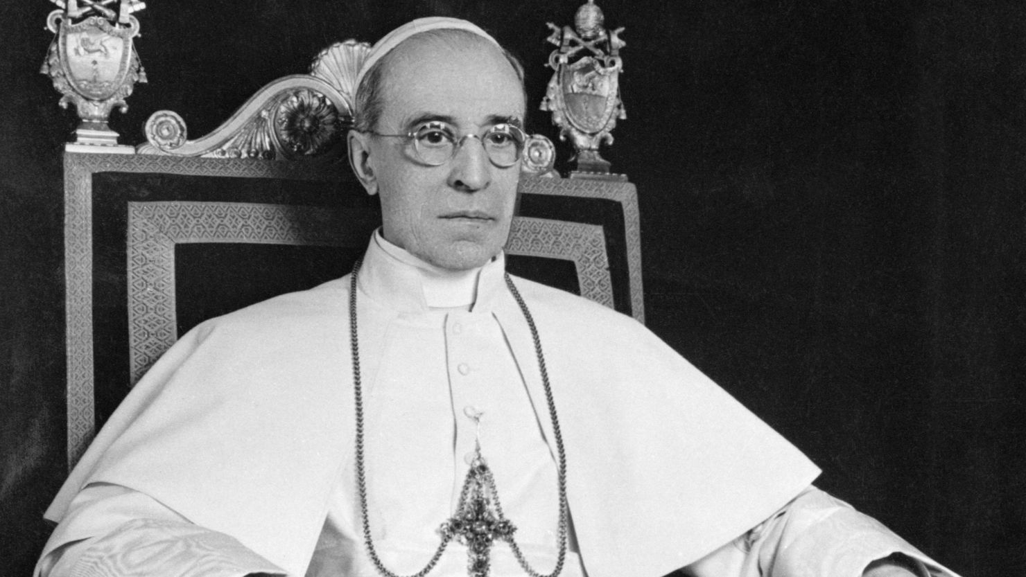 Pope Pius XII sits for an official portrait on his 75th birthday.