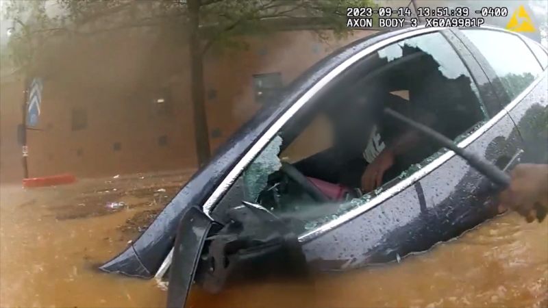 Police Bodycam Captures Rescue In Waist-high Floodwaters | CNN