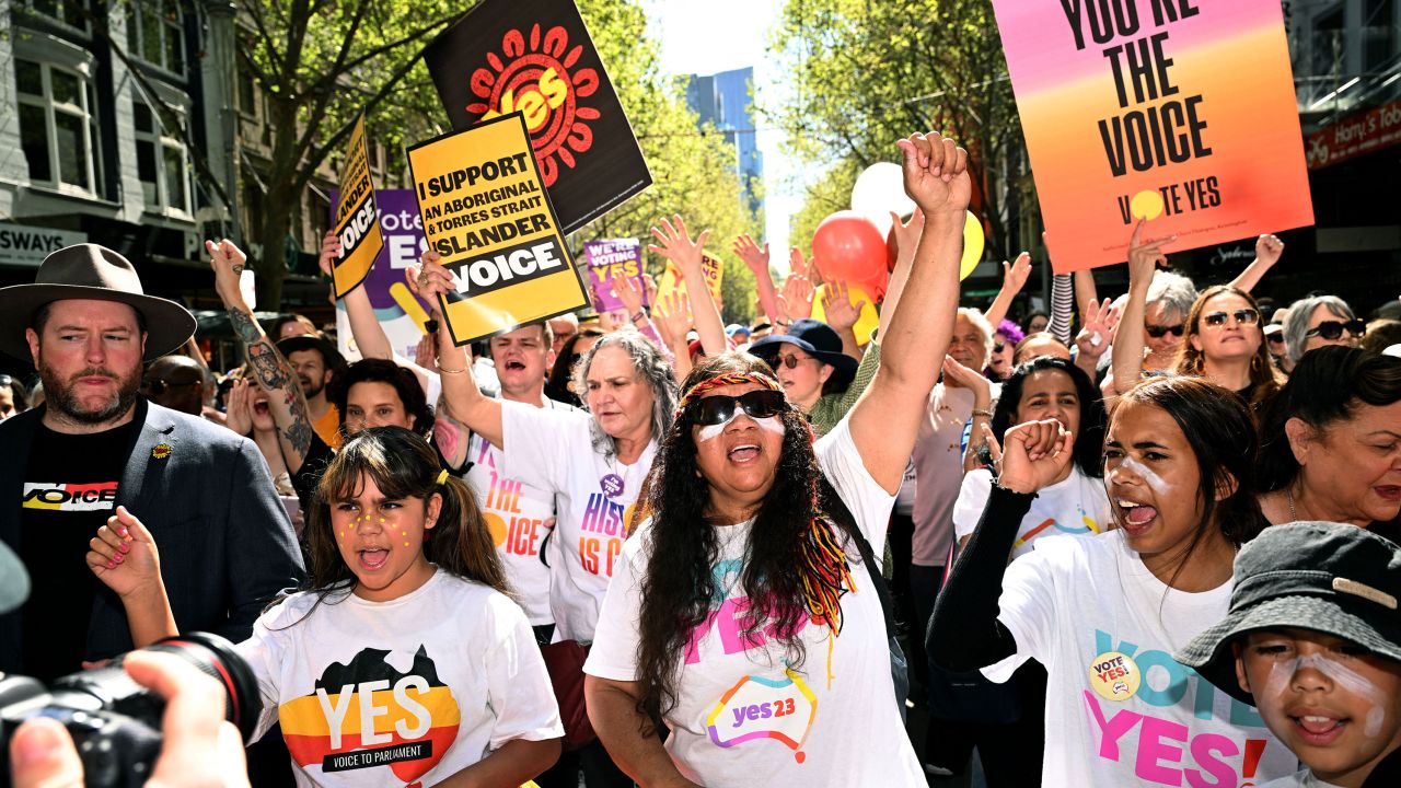 Crowds march during a "Walk for Yes" rally in Melbourne on September 17, 2023. 