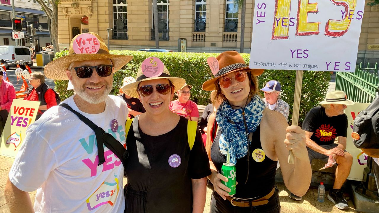 Erin Johnston (center) with friends Michael Blair (left) and Andy Roache (right) at a Yes rally in Brisbane on Sunday, September 17, 2023.