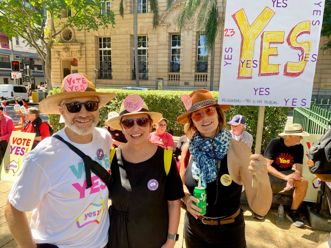 Erin Johnston (center) with friends Michael Blair (left) and Andy Roache (right) at a Yes rally in Brisbane on Sunday, September 17, 2023.